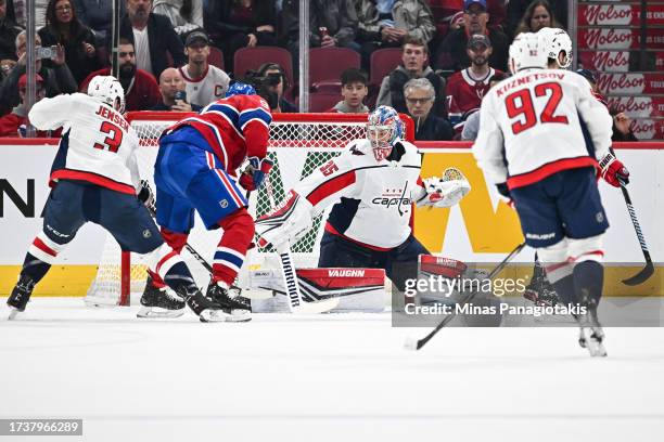 Sean Monahan of the Montreal Canadiens shoots the puck towards goaltender Darcy Kuemper of the Washington Capitals during the first period at the...