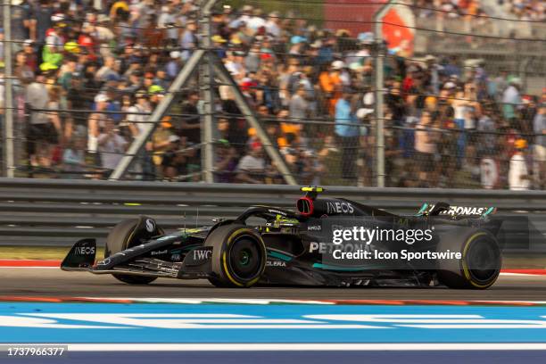 Mercedes AMG Petronas F1 Team driver Lewis Hamilton of the United Kingdom speeds through turn 17 while fans look on in the background during the...