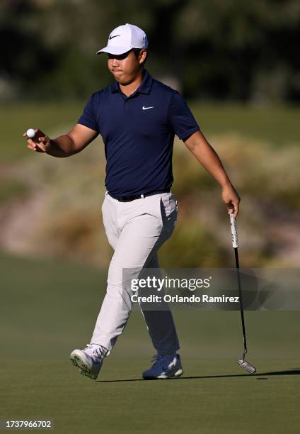 Tom Kim of South Korea reacts to his birdie putt on the 15th green during the final round of the Shriners Children's Open at TPC Summerlin on October...