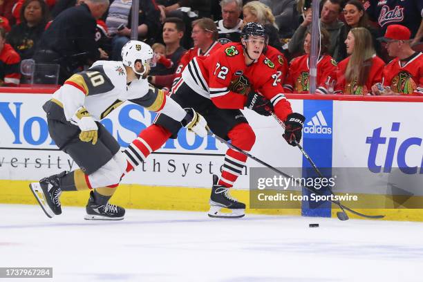 Vegas Golden Knights center Nicolas Roy and Chicago Blackhawks defenseman Alex Vlasic in action during a game between the Vegas Golden Knights and...