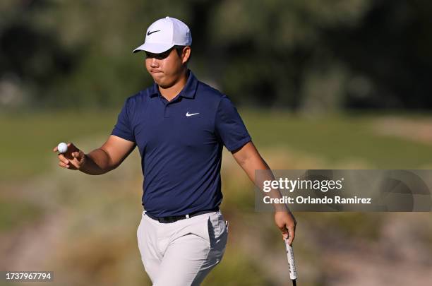 Tom Kim of South Korea reacts to his birdie putt on the 15th green during the final round of the Shriners Children's Open at TPC Summerlin on October...