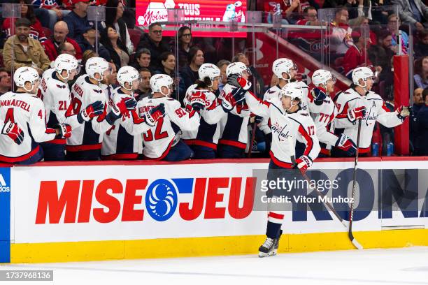 Dylan Strome of the Washington Capitals celebrates a goal with the bench during the third period of the NHL regular season game against the Montreal...