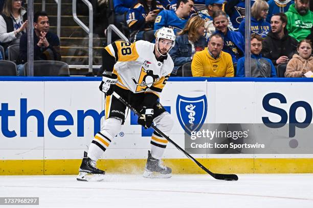 Pittsburgh Penguins defenseman Marcus Pettersson looks for a teammate to pass the puck to during a regular season game between the Pittsburgh...