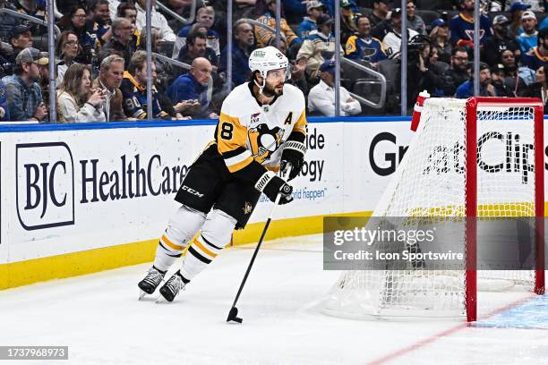 Pittsburgh Penguins defenseman Kris Letang skates the puck out from behind the net during a regular season game between the Pittsburgh Penguins and...