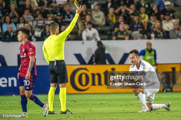 Maya Yoshida of Los Angeles Galaxy protests his yellow card during the game against FC Dallas at Dignity Health Sports Park on October 21, 2023 in...