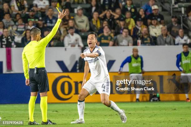 Maya Yoshida of Los Angeles Galaxy protests his yellow card during the game against FC Dallas at Dignity Health Sports Park on October 21, 2023 in...