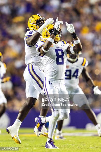 Tigers defensive end Ovie Oghoufo recovers a fumble during a game between the LSU Tigers and the Army Black Knights on October 21 at Tiger Stadium in...