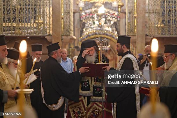 Greek Orthodox Patriarch of Jerusalem Theophilos III leads prayers during a procession dedicated to peace in Israel and Gaza, at the Holy Sepulchre...