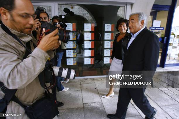 Socialist deputy and former Minister Dominique Strauss-Kahn is photographed walking on the street with his wife French journalist Anne Sinclair...