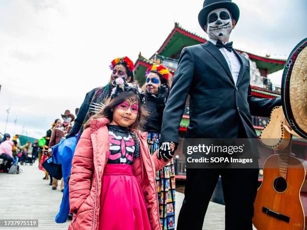 Mexican man and his daughter are seen wearing traditional Mexican costumes. The Mexican Talent Network in collaboration with the Embassy of Mexico in...