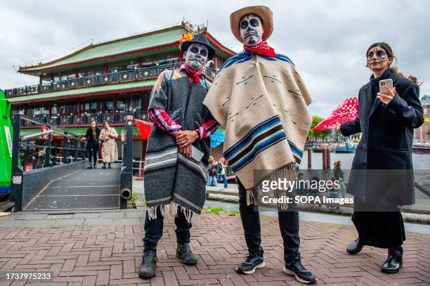 Two Mexican men are seen dressing like Catrin . The Mexican Talent Network in collaboration with the Embassy of Mexico in the Netherlands celebrated...