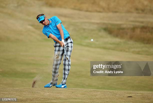 Ian Poulter of England hits a shot on the 6th hole during the first round of the 142nd Open Championship at Muirfield on July 18, 2013 in Gullane,...