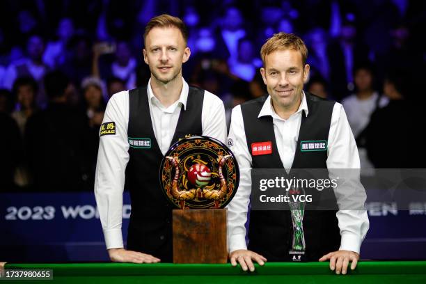Judd Trump of England of England and Ali Carter of England pose with trophies after the Final match on day 7 of 2023 Wuhan Open at Wuhan Gymnasium on...