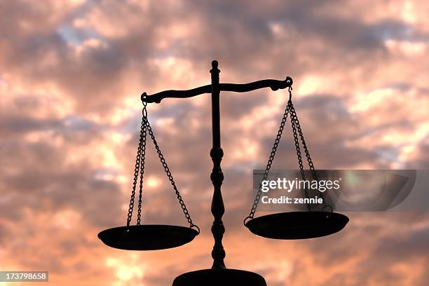 balance scale against multi-colored sky - ethics scale stock pictures, royalty-free photos & images