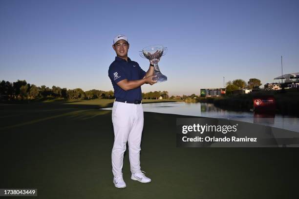 Tom Kim of South Korea poses with the trophy after putting in to win on the 18th green during the final round of the Shriners Children's Open at TPC...