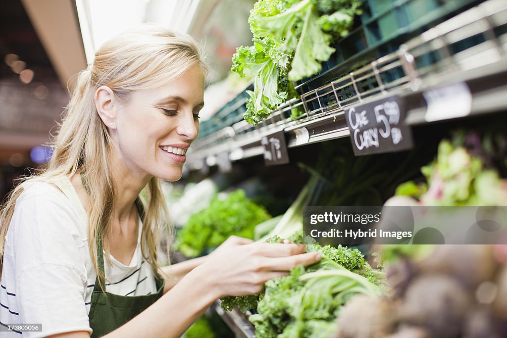 Grocer working in produce section