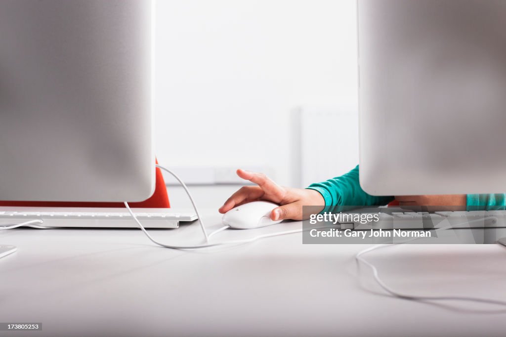 Girl using computer at desk