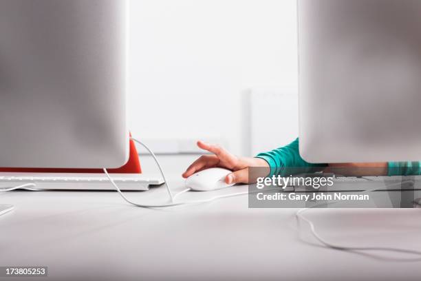 girl using computer at desk - kids computer mouse stock pictures, royalty-free photos & images