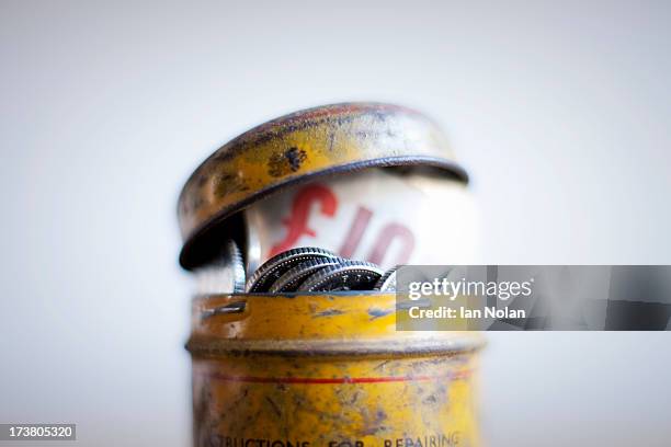 antique tin full of money on desk - ten pound note stock pictures, royalty-free photos & images