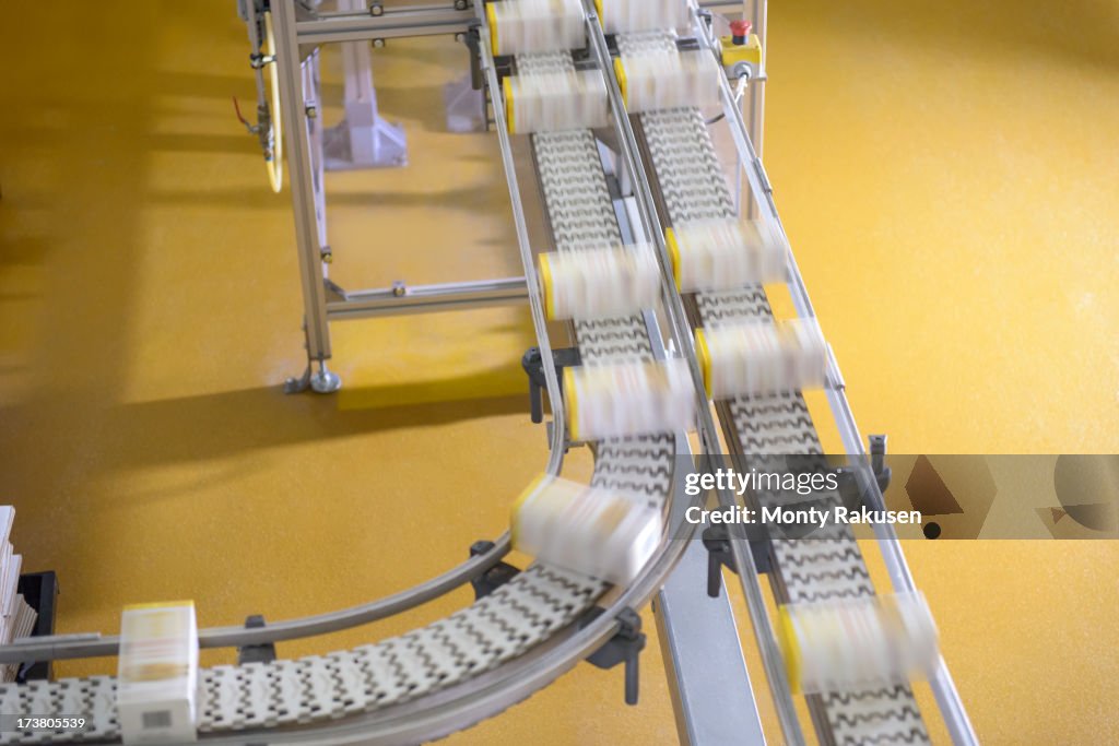 Packed products on conveyor belt in biscuit factory