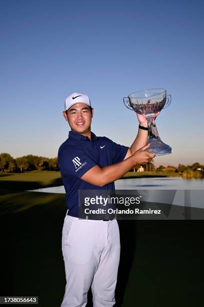 Tom Kim of South Korea poses with the trophy after putting in to win on the 18th green during the final round of the Shriners Children's Open at TPC...