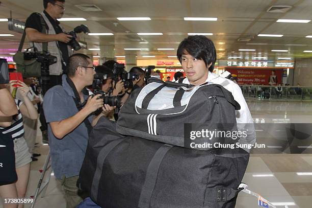 Masato Kudo of Japan arrives ahead of the 2013 EAFF East Asian Cup at the Gimpo International Airport on July 18, 2013 in Seoul, South Korea.