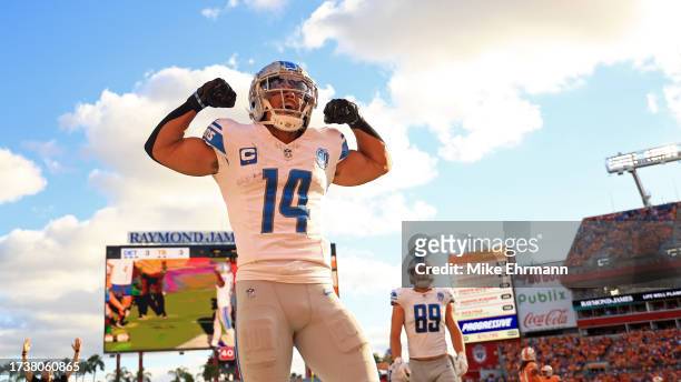 Amon-Ra St. Brown of the Detroit Lions celebrates a touchdown during a game against the Tampa Bay Buccaneers at Raymond James Stadium on October 15,...