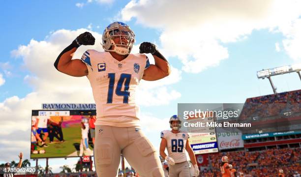 Amon-Ra St. Brown of the Detroit Lions celebrates a touchdown during a game against the Tampa Bay Buccaneers at Raymond James Stadium on October 15,...