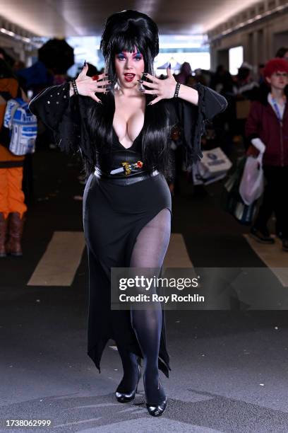 Cosplayer poses as Elvira during New York Comic Con 2023 - Day 4 at Javits Center on October 15, 2023 in New York City.