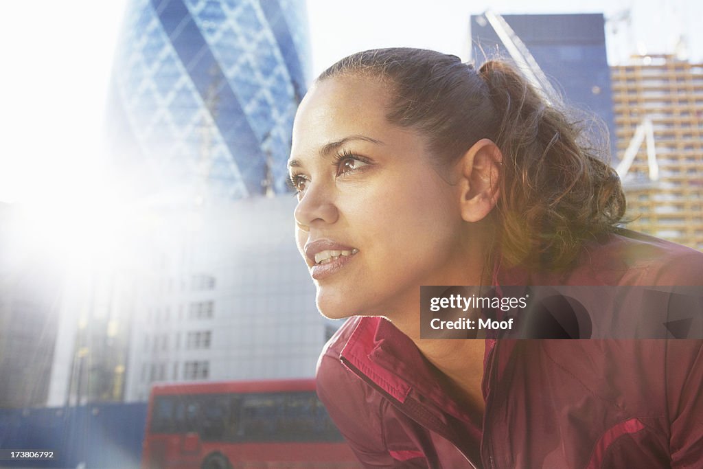 Woman standing on city street