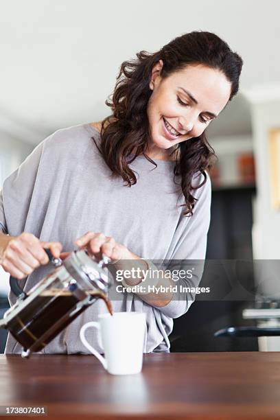 woman making french press coffee - coffee plunger stock pictures, royalty-free photos & images