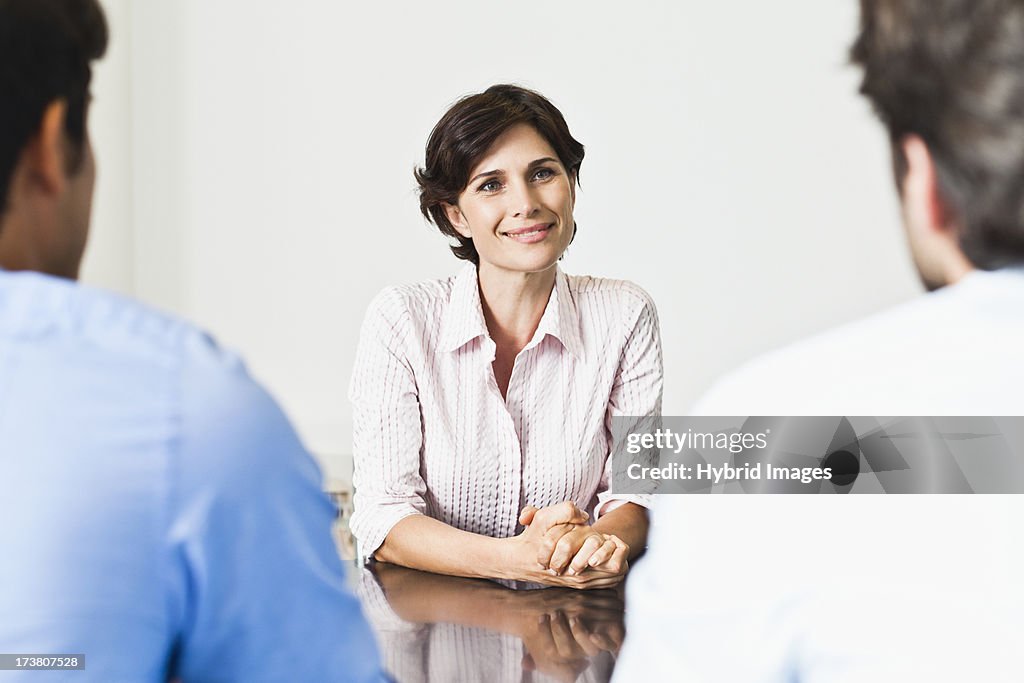 Business people talking at desk