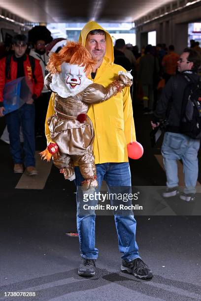 Cosplayer poses as Pennywise and Georgie from IT during New York Comic Con 2023 - Day 4 at Javits Center on October 15, 2023 in New York City.
