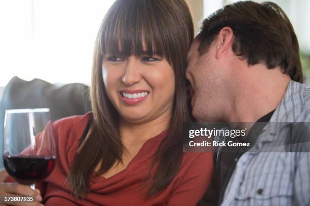 couple relaxing on sofa - disgust stock pictures, royalty-free photos & images