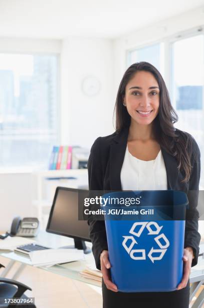 caucasian businesswoman holding recycle bin - waste management office stock pictures, royalty-free photos & images