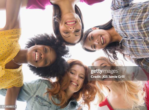 smiling women standing in circle - five people standing stock pictures, royalty-free photos & images