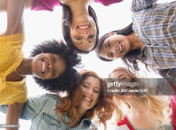 smiling women standing in circle - five friends unity stock pictures, royalty-free photos & images