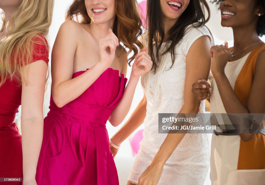 Women dancing together at party