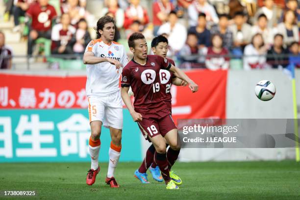 Kazuma Watanabe of Vissel Kobe controls the ball against Dejan Jakovic of Shimizu S-Pulse during the J.League J1 first stage match between Vissel...