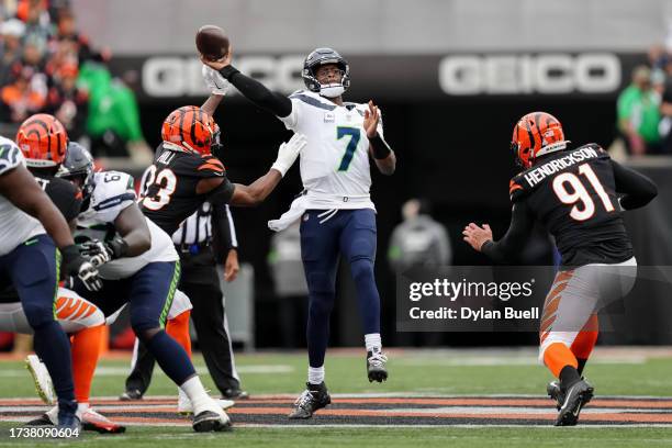 Dax Hill of the Cincinnati Bengals deflects a pass attempt by Geno Smith of the Seattle Seahawks in the second quarter at Paycor Stadium on October...