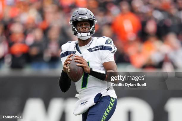 Geno Smith of the Seattle Seahawks drops back to pass in the third quarter against the Cincinnati Bengals at Paycor Stadium on October 15, 2023 in...