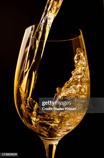 wine pouring into wine glass - wine splashing stock pictures, royalty-free photos & images