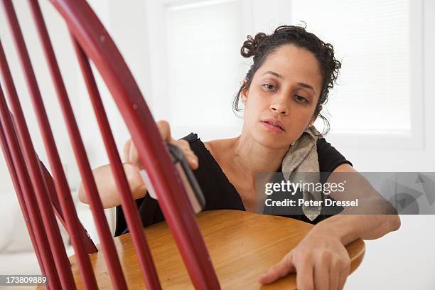 hispanic woman sanding chair - restoring chair stock pictures, royalty-free photos & images