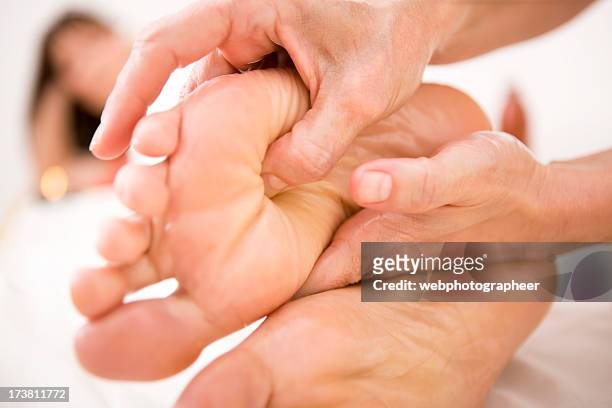foot massage - woman soles stockfoto's en -beelden