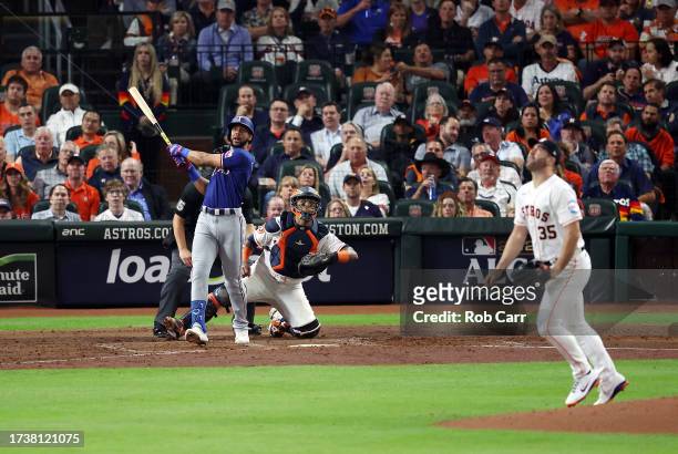 Leody Taveras of the Texas Rangers hits a solo home run in the fifth inning against the Houston Astros during Game One of the American League...