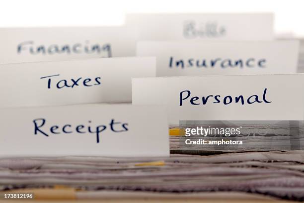 file labels showing financial and personal filing system - filing documents stock pictures, royalty-free photos & images