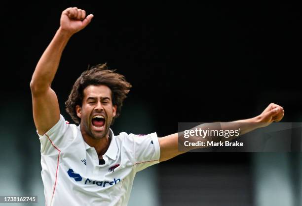 Wes Agar of the Redbacks celebrates the wicket of Moises Henriques captain of the Blues during the Sheffield Shield match between South Australia and...