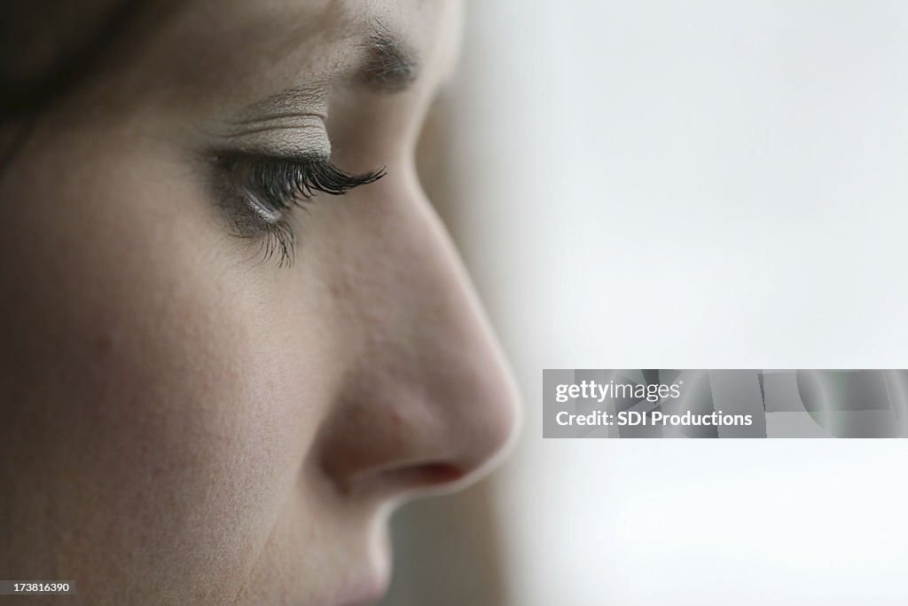 Closeup Profile of Depressed Young Woman