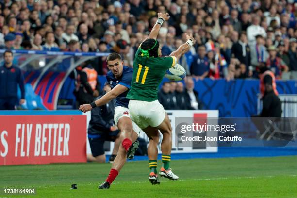 The conversion of Thomas Ramos of France is tackled by Cheslin Kolbe of South Africa during the Rugby World Cup France 2023 Quarter Final match...