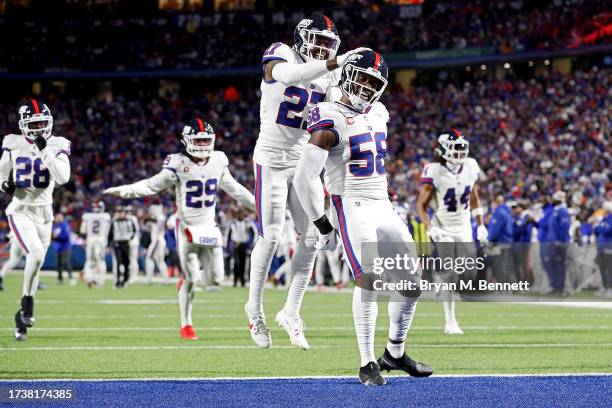 Bobby Okereke of the New York Giants celebrates after an interception by teammate Micah McFadden in the second quarter of a game against the Buffalo...